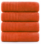 600-GSM bath sheet in seven vibrant colors neatly stacked on a table