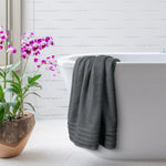 Rolled bath sheet towel with elegant décor